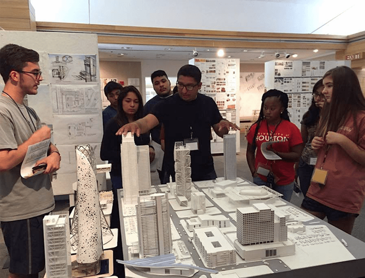 architecture students and their models on the table