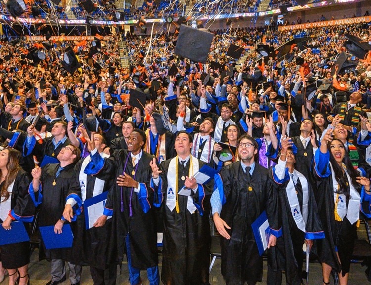 graduates tossing their cap
