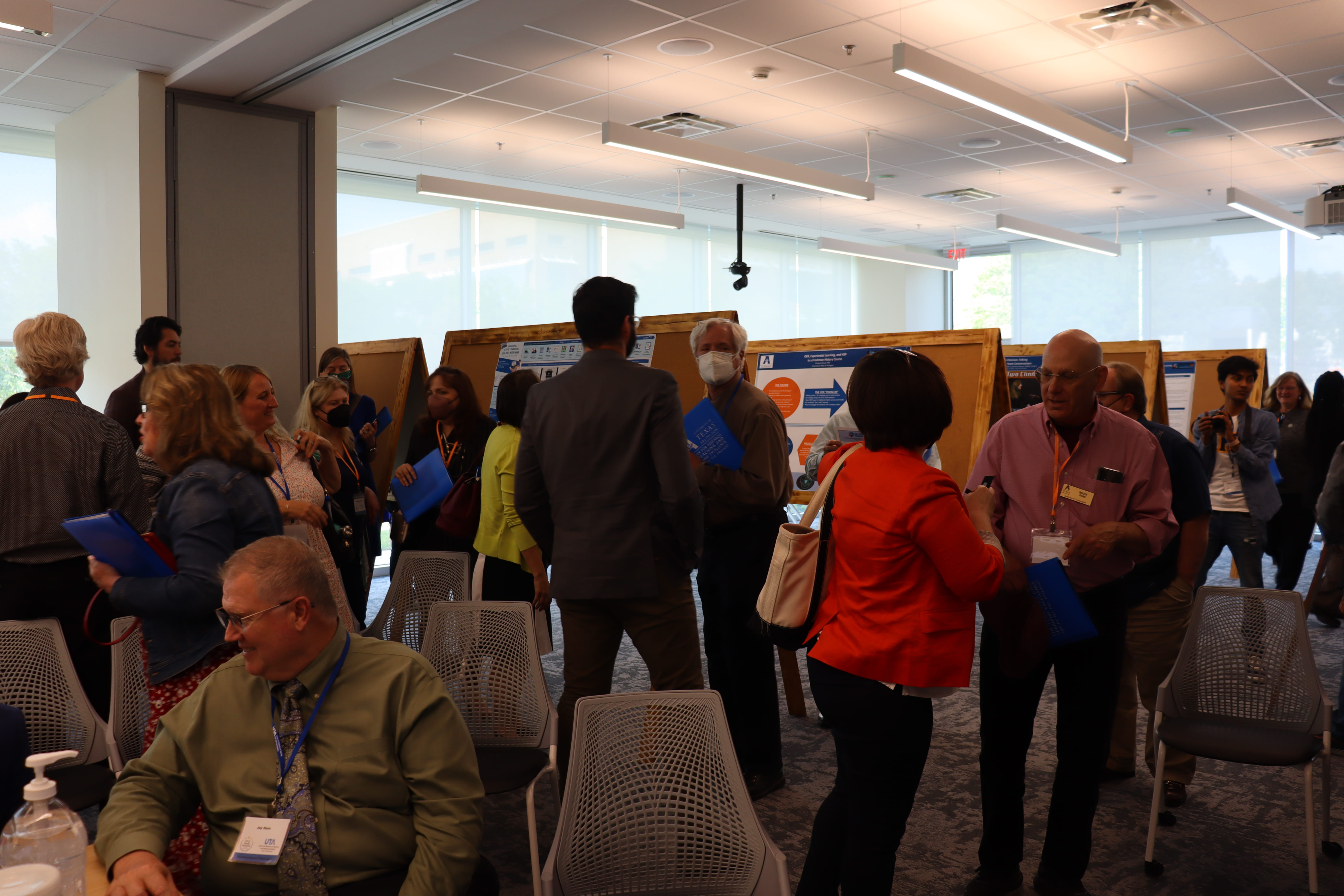 Group of people at conference poster session