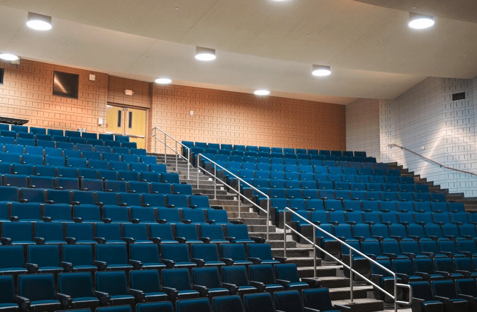 lecture hall with blue chairs