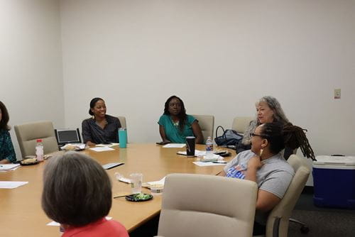 several faculty in a meeting