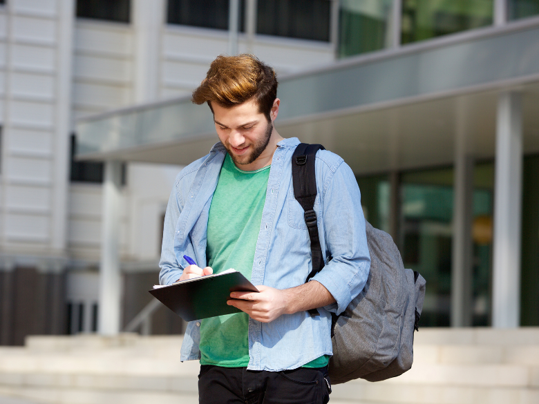 student taking notes