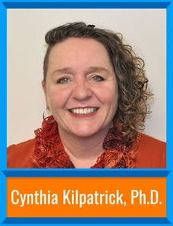 Cynthia Kilpatrick stands with curly hair in front of a neutral background. There's a border around the image and her name is at the bottom, "Cynthia Kilpatrick, Ph.D."