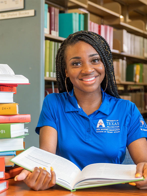 New Maverick Orientation Leader researching in the Central Library. 