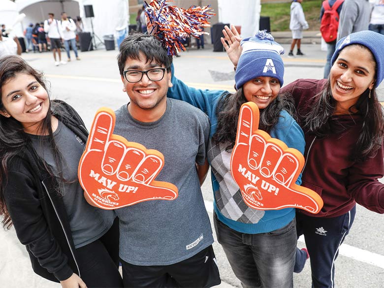 Students pose for picture at the 2019 Homecoming Parade