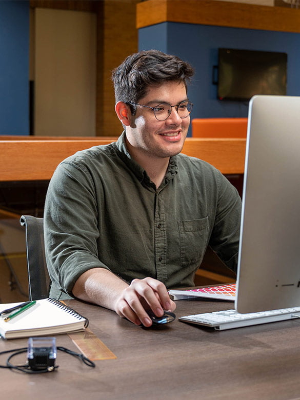 UTA student studies in University Center.