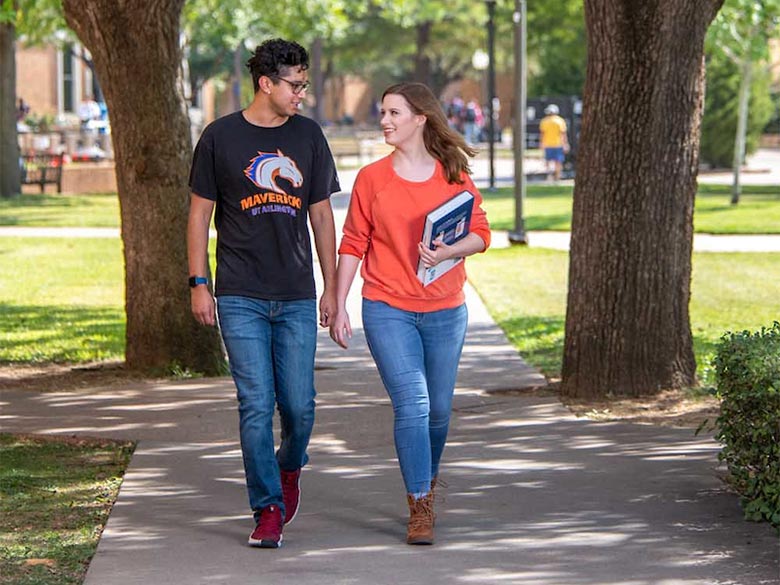 Students walking and talking outside the Central Library.