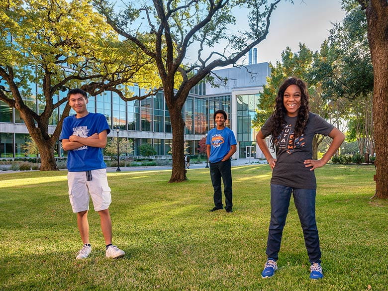 Students pose on the west lawn of the Science Engineering Innovation Research building. 