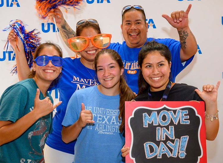 Family posing in photo booth during UTA Move-in Day