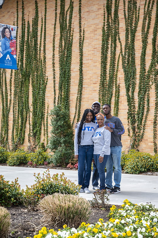 Family posing in front the Life Science building