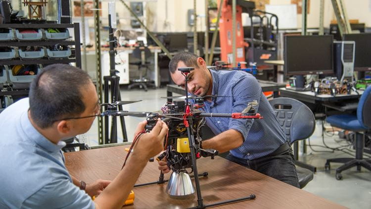 Researchers working on a drone