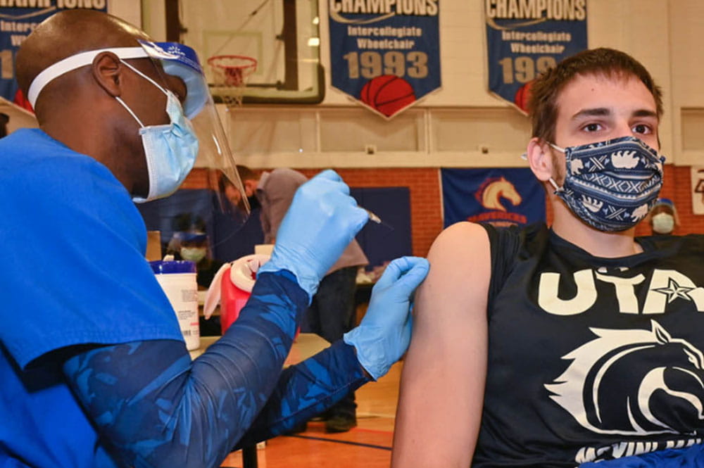 student getting vaccinated on campus