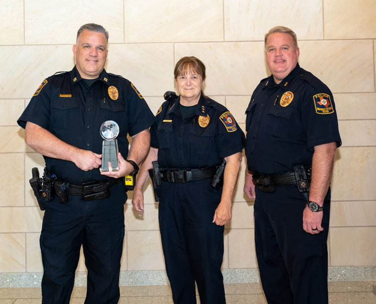 photo of 3 officers receiving an award