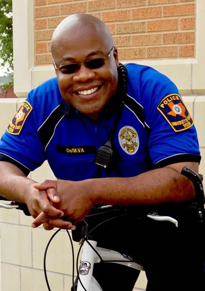 photo of a police officer sitting on his bike