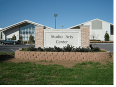 the front of the studio arts center at UTA