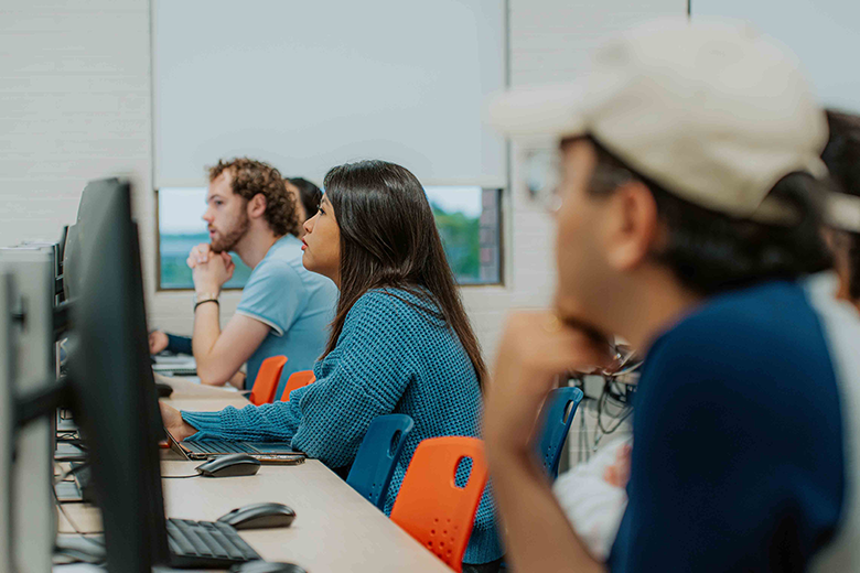 Students in classroom in front of computers