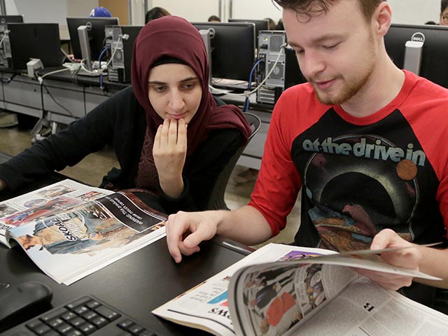 Students flipping through magazines