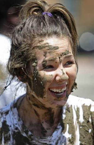 Lauren Devoll covered in mud at the 2013 Oozeball event