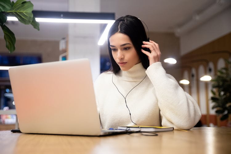 Woman sitting at laptop