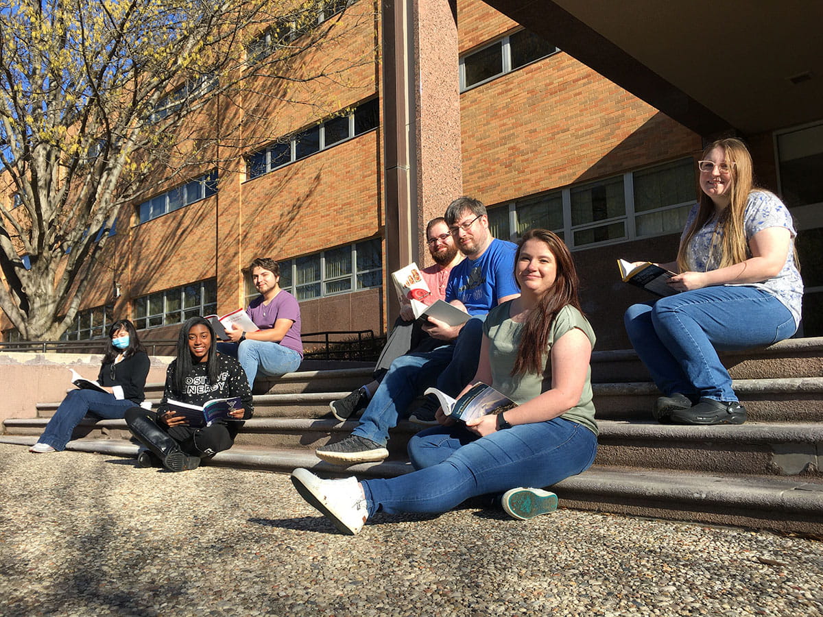 students sitting on steps