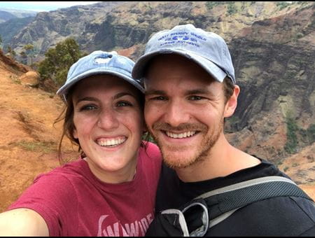 Kyle Duncan with wife hiking