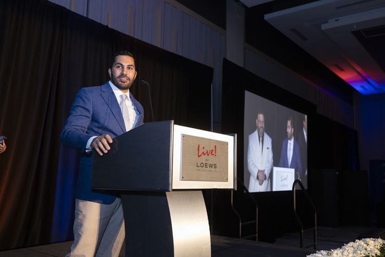 Andrew Feghali, Brampton Supply Company Founder, gives a speech after his company was recognized as the fastest growing UTA alumni led business at the 5th annual MAVS100 event at Live! By Loews in Arlington, Texas on May 3, 2023.
