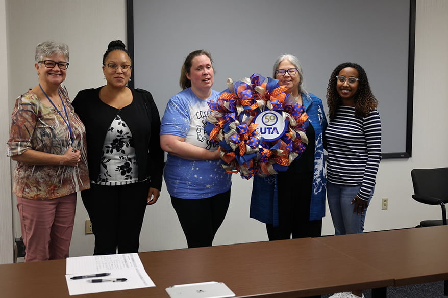 Dean Merwin receiving wreath from ANSA student organization