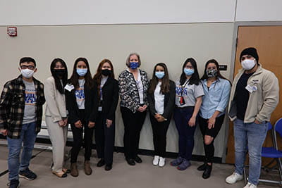 Dr. Rebecca Garner posing with a group of students