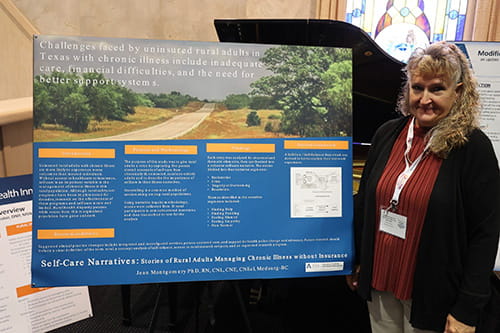 Rural Health Conference attendee displaying a poster