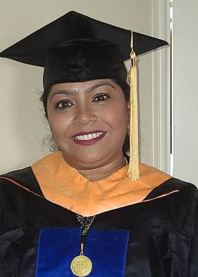 Portrait of Sally Koshy wearing cap and gown