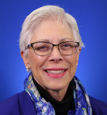 Portrait of Deana Furr wearing a blue blazer and scarf