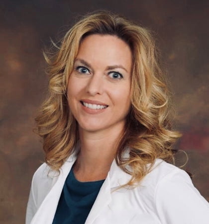 Portrait of Heather Skrivanek wearing a white coat.