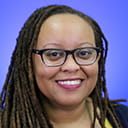 Portrait of Kyrah Brown with a blue background