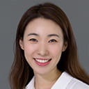 Portrait of Yeonwoo Kim with a dark gray background