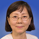 Portrait of Yaewon Seo with a blue background