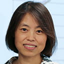 Portrait of Jing Wang in a lecture setting