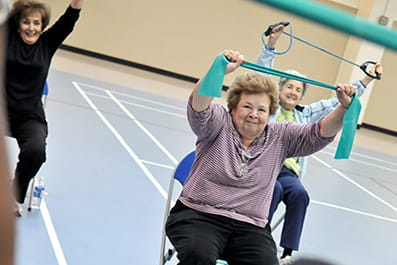 Senior ladies exercising with stretch bands