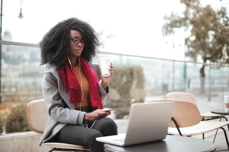 A woman works on a laptop 