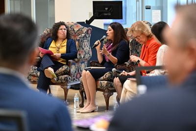 Photo of Dr. Elsa Camargo speaking at the Latinas in Education panel event
