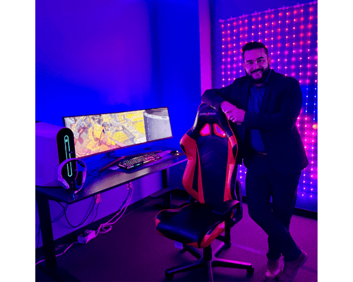 Luis Perez Cortes standing in a gaming space inside the Basement, a space for esports players on the U T A campus