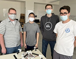 UTA electrical engineering students participating in the Raytheon-sponsored drone showcase