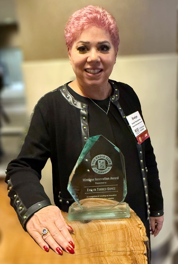 Evelyn Torres-Gomez pictured with her acrylic award" _languageinserted="true