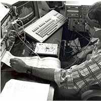 A student focuses on a computer printout