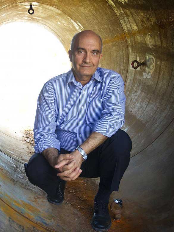 Mo Najafi, Ph.D. inside a pipe prepared to place underground.