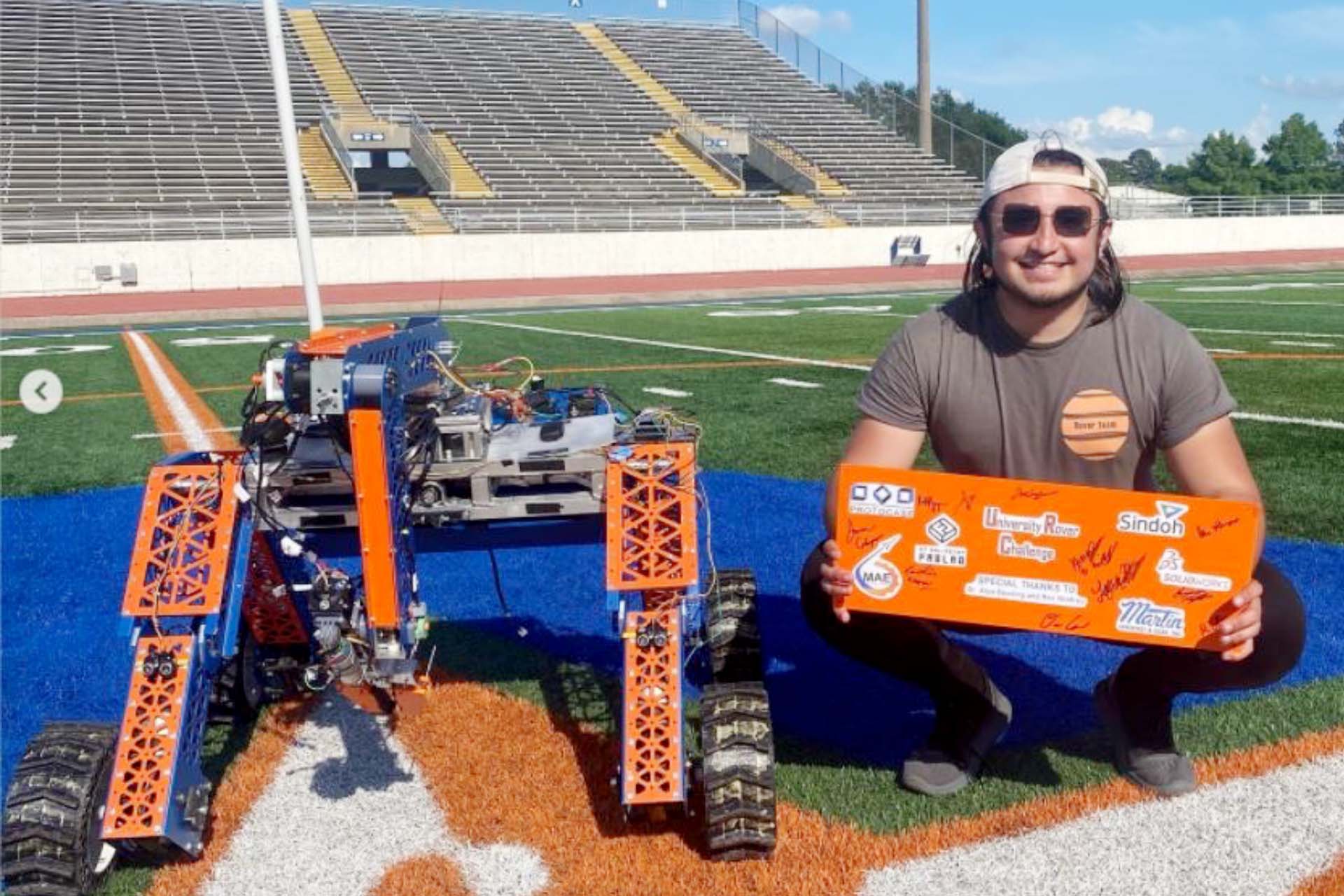 UTA Engineering Student Jorge Levario with UTA's ROVER