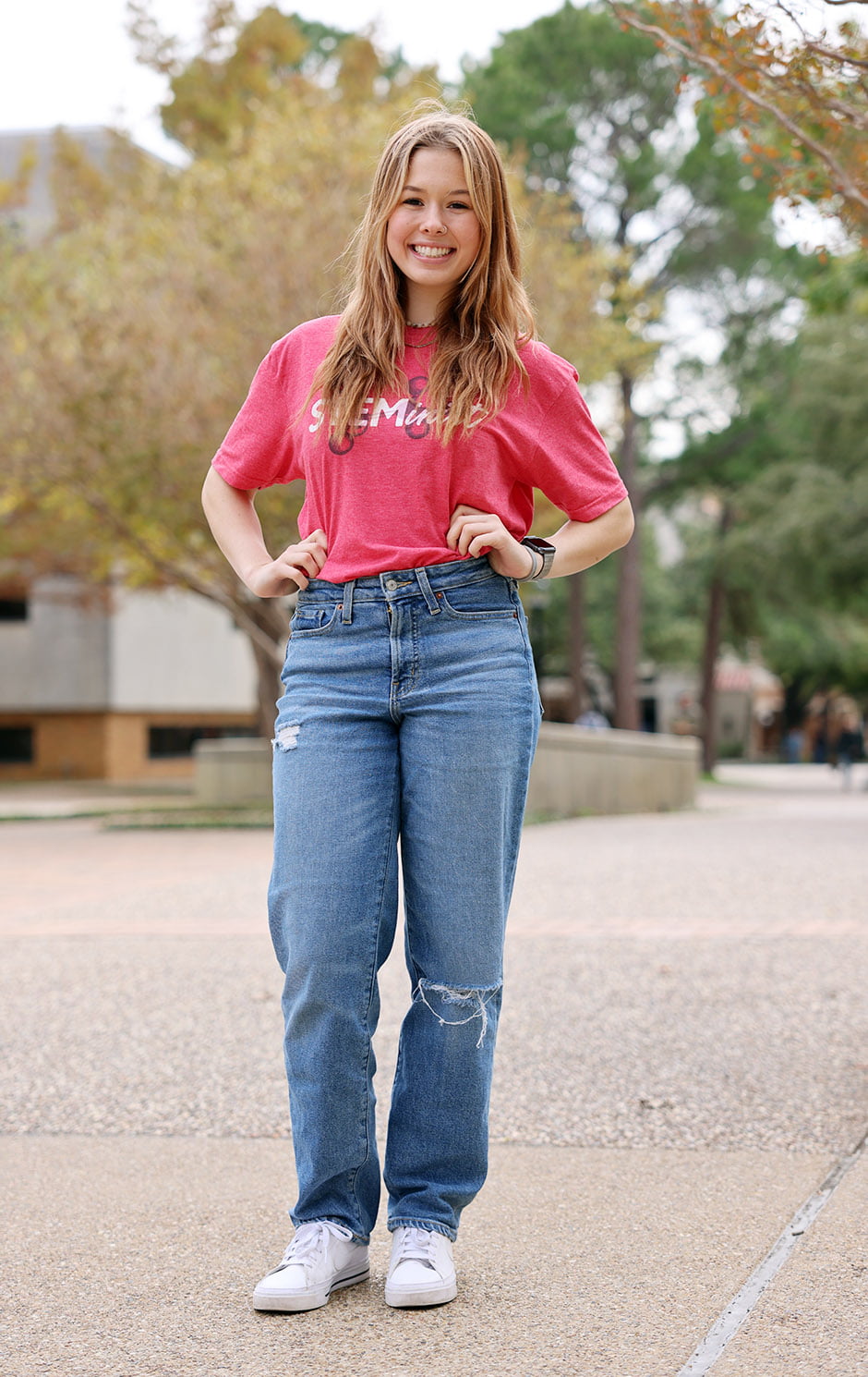 UTA architectural engineering student Parker Jones stands on the sidewalk outside Nedderman Hall.