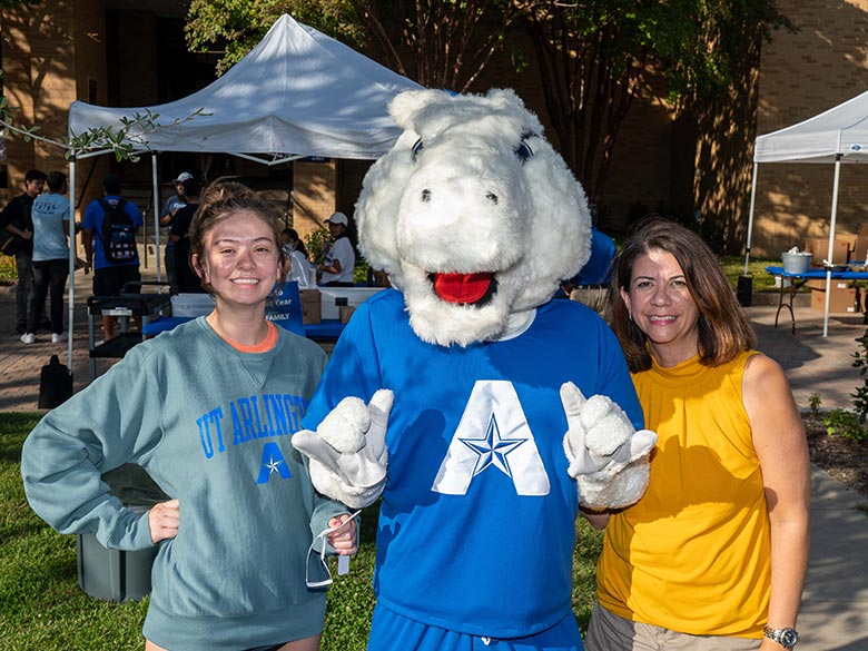 Blaze and family pose at Parent and Family Weekend.