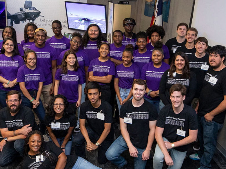 Students pose for a picture at the Lockheed Martin Aeronautics and Cybersecurity Summer Camp.