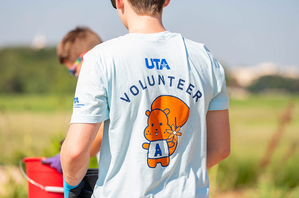 Student wearing volunteer shirt
