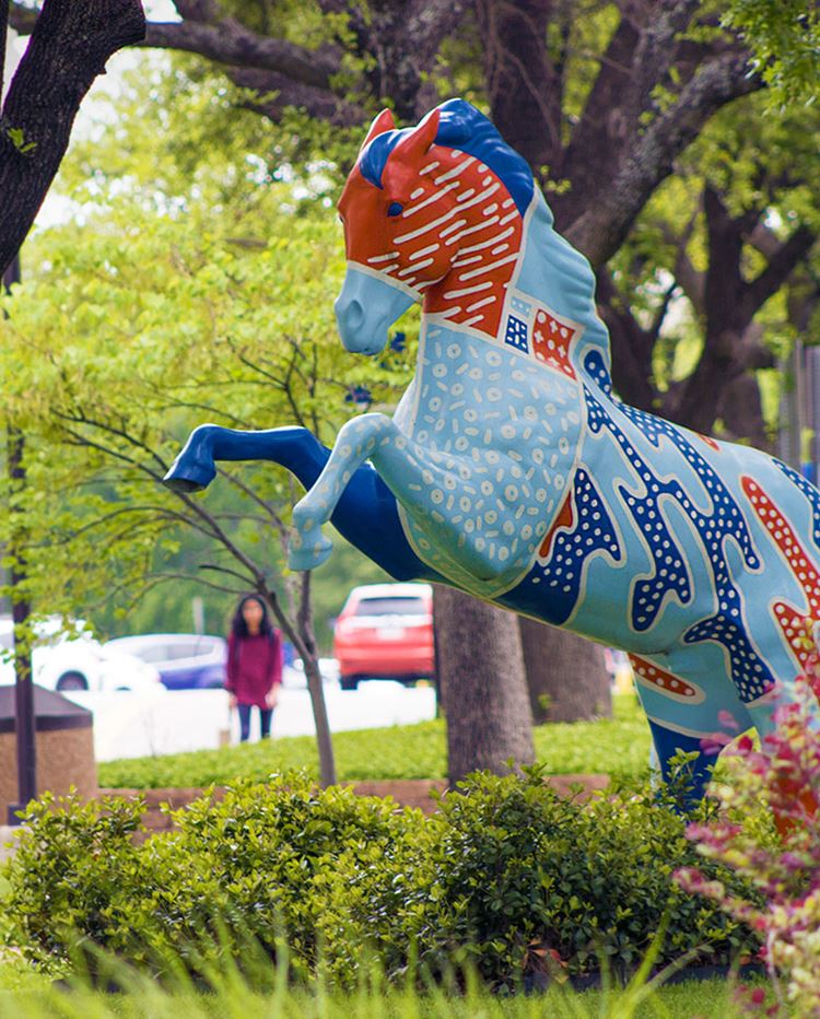 Horse statue paintedwith mav orange and blue